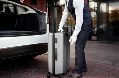 side-view-valet-holding-baggage (3) (1)